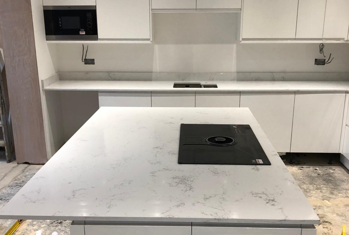 Carrara quartz worktops and island with hob