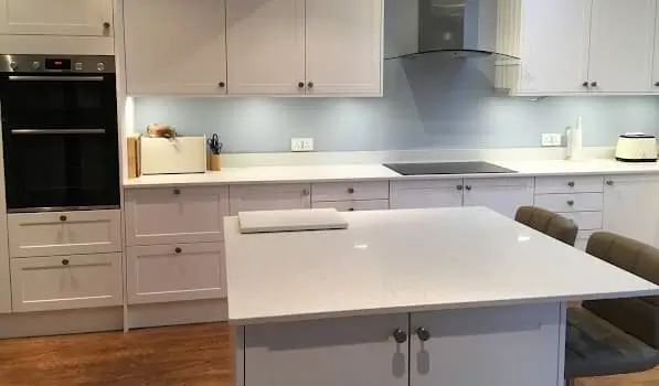 White mirror quartz worktops with island installed in Harlow