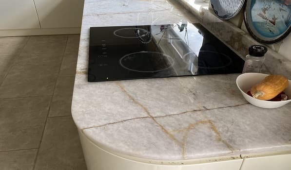 Close-up of veined quartzite kitchen worktop
