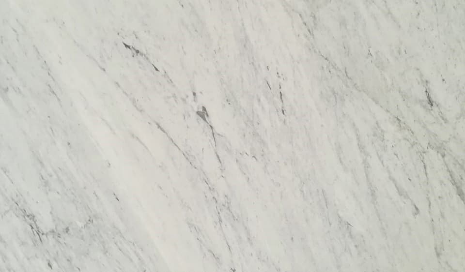 Carrara marble worktop in modern white kitchen