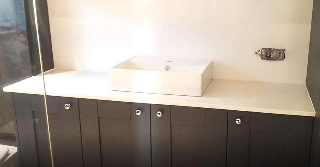 white shimmer quartz vanity top installed in brentwood