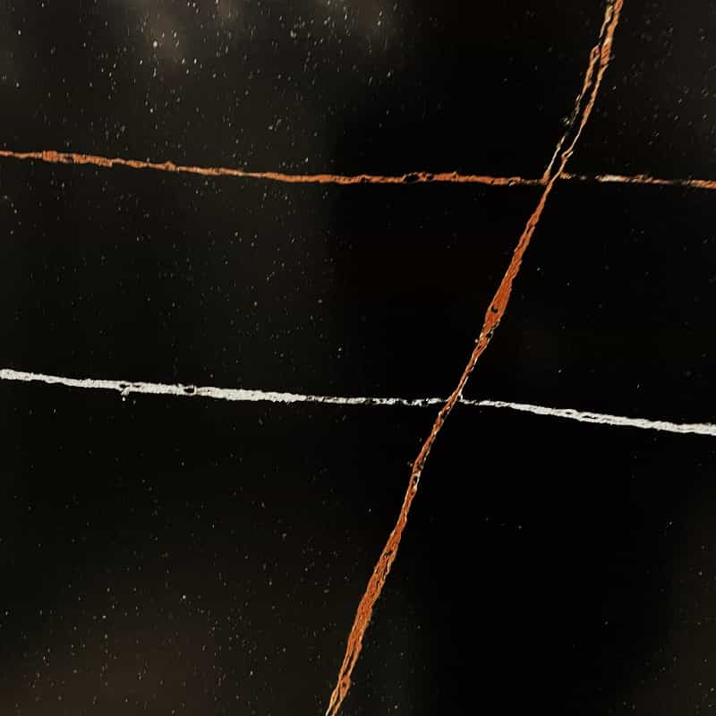 dark quartz worktop with light reflective speckle pattern